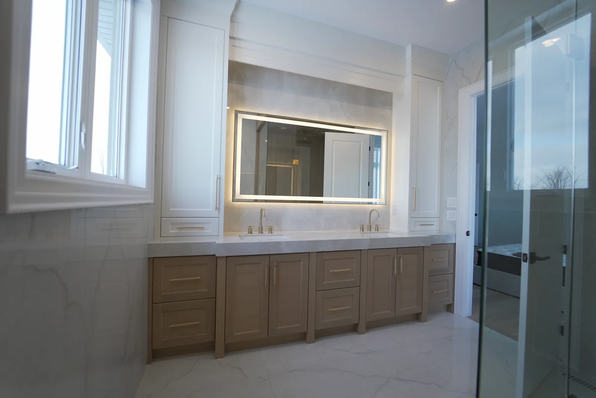Detailed angle across a pale stone double vanity counter